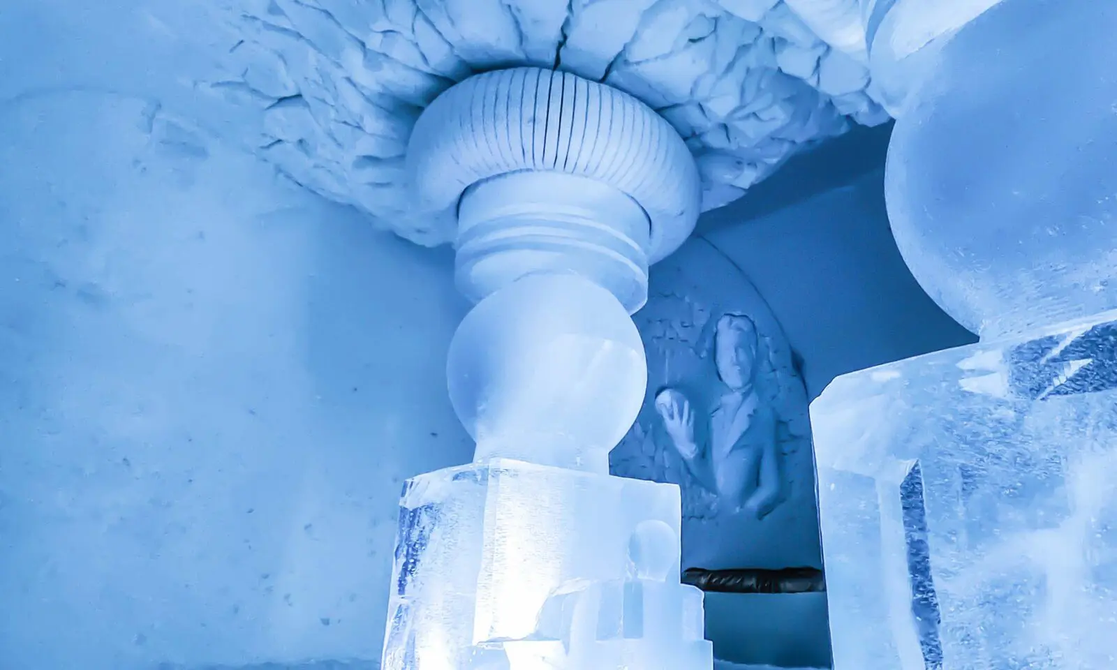 Rounded snow corridor with doorways cut into both sides