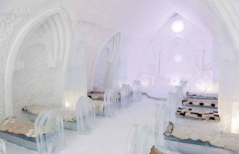 Vaulted snow arch over a passage with ice blocks set into the wall